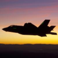 F-35 first night flight -- plane against sunset sky